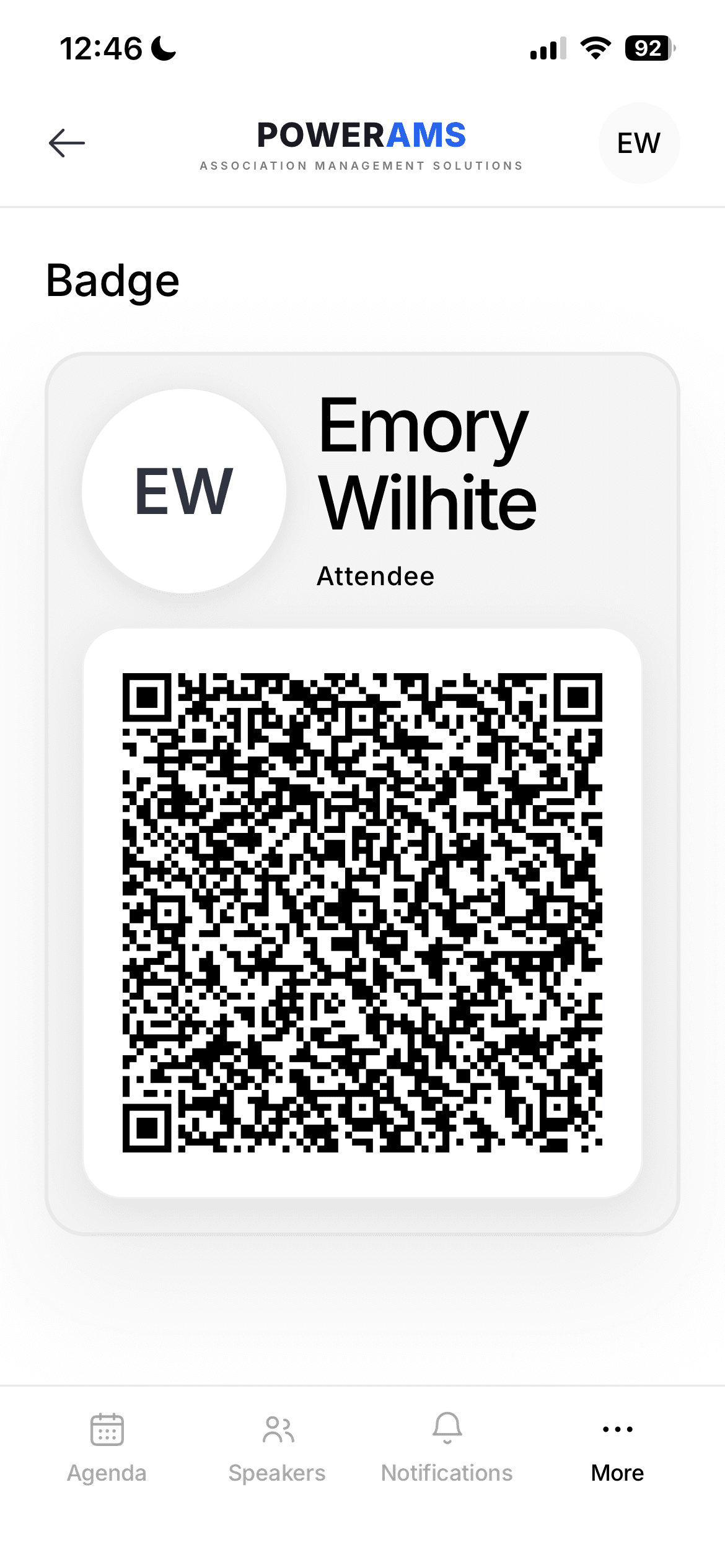 The attendee app digital badge — name, role, and QR code for check-in
